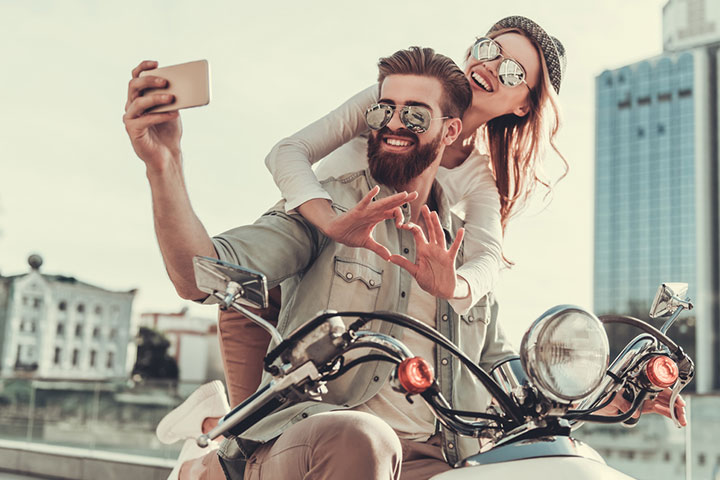 Posing on a motorbike with sunglasses, couple photo pose ideas
