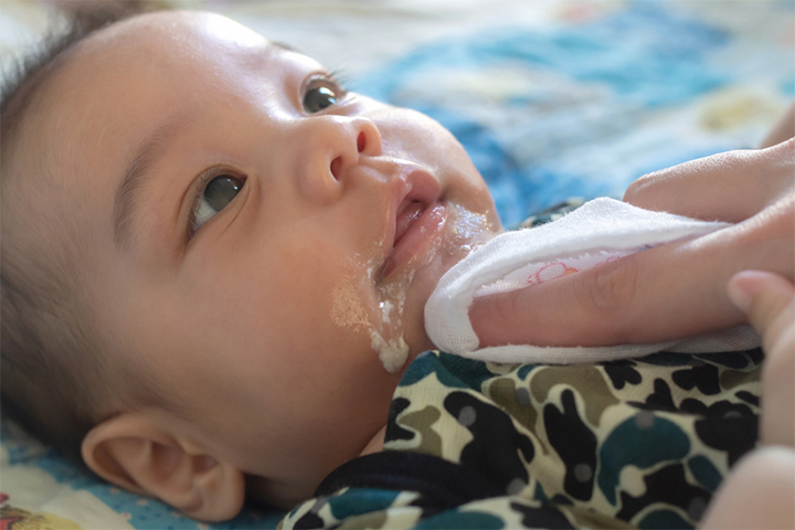 Overfeeding a baby can result in repeated spitting