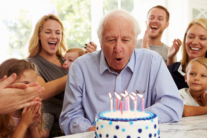 Family celebrating 70-year-old Grandpa's birthday