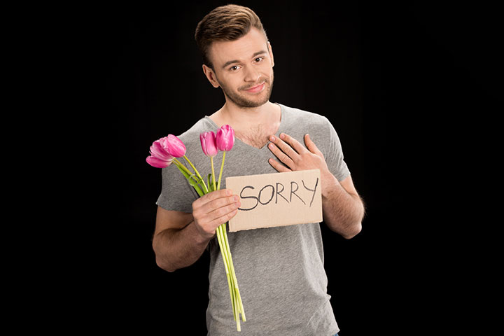 Man saying sorry with flowers