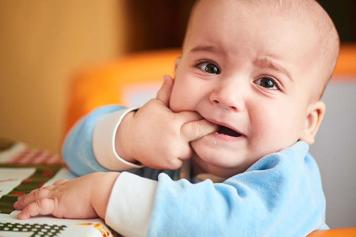 Baby's sucking hand could be due to teething